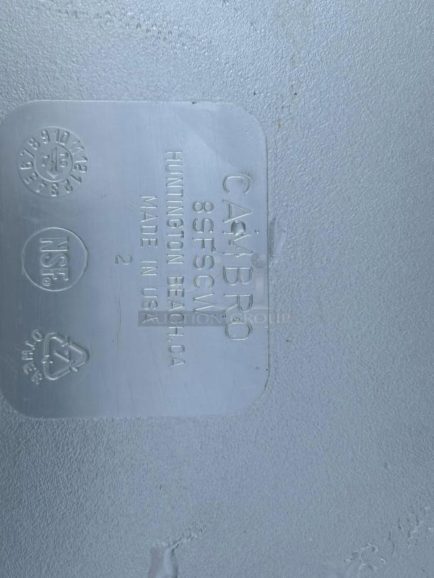 Clear polycarbonate container base showing NSF certification. Embossed markings: "CAMBRO" and "Made in USA."