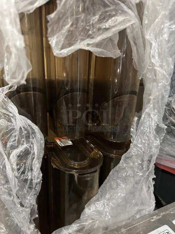 Clover Vertica Coffee Tower System in like-new condition, partially wrapped, showing multiple tubes and labels. 220V/3 Phase.