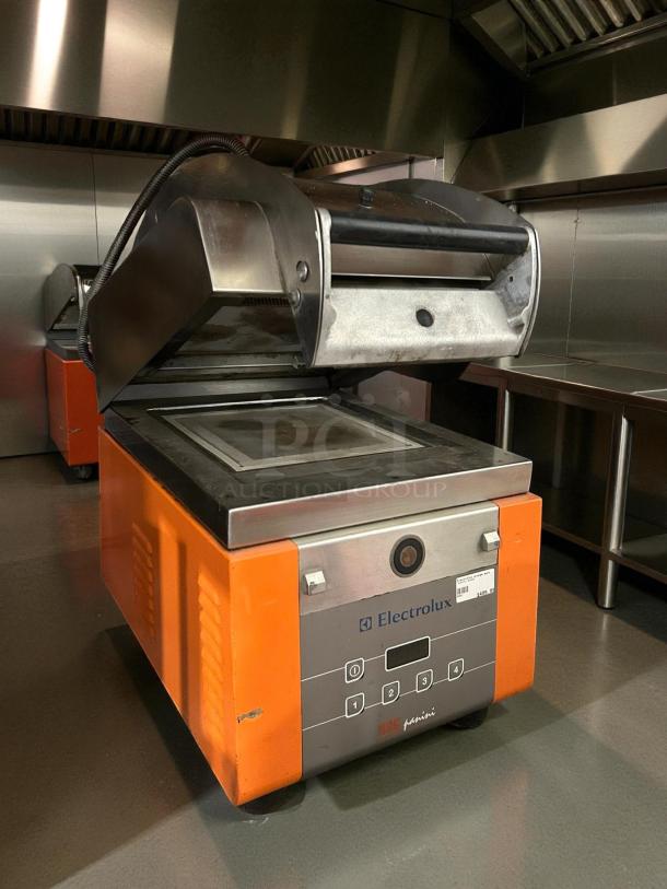 Electrolux HSPPME high-speed panini grill, orange and stainless steel, 208V, ETL & NSF listed, tested and operational.