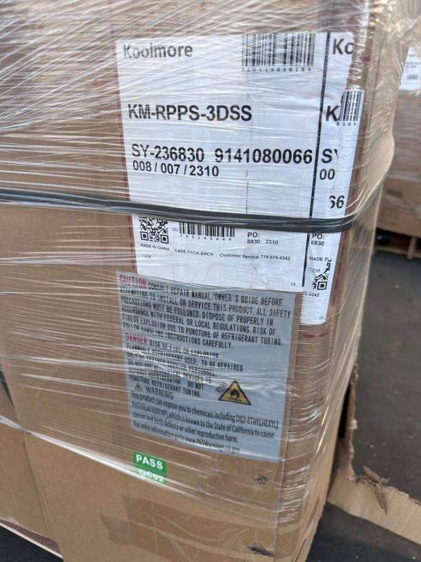 Brand new Koolmore 92" three-door pizza prep refrigerator, model KM-RPPS-3DSS, with scratch and dent condition. Labels detail model and safety warnings.