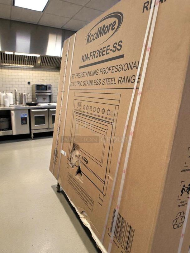 KoolMore 36" Electric Range (KM-FR36EE-SS) in box; marked "scratch & dent"; visible tear on cardboard packaging.