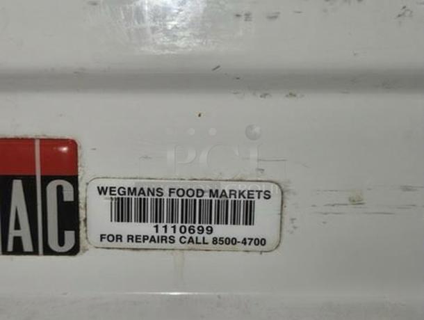 Brand New JAC VARIA 800 Bread Slicer, Scratch & Dent model, label showing contact for Wegmans repairs.