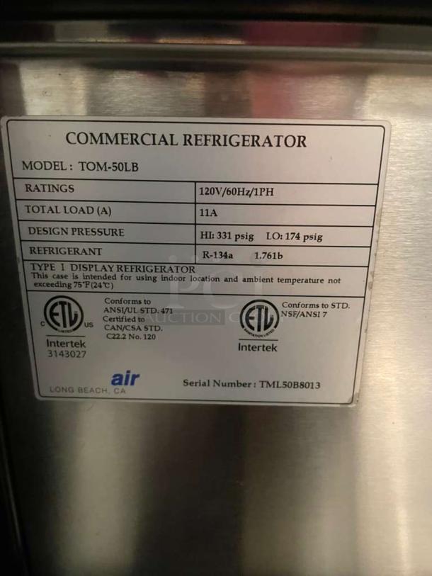 Turbo Air TOM-50LB commercial display refrigerator label showing model, ratings, refrigerant type, and certifications.