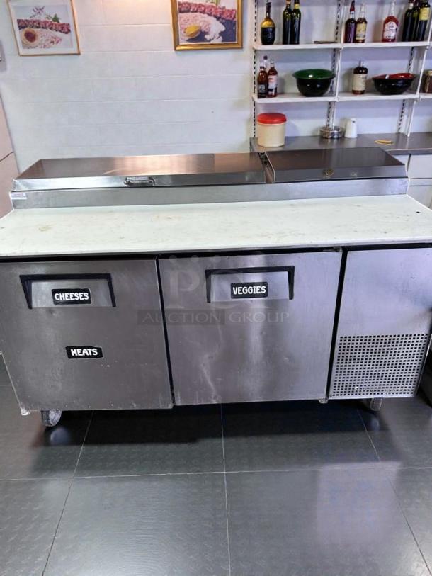 True TPP-67 commercial prep table, fully tested, labeled sections for cheeses, veggies, heats; stainless steel, 115V.