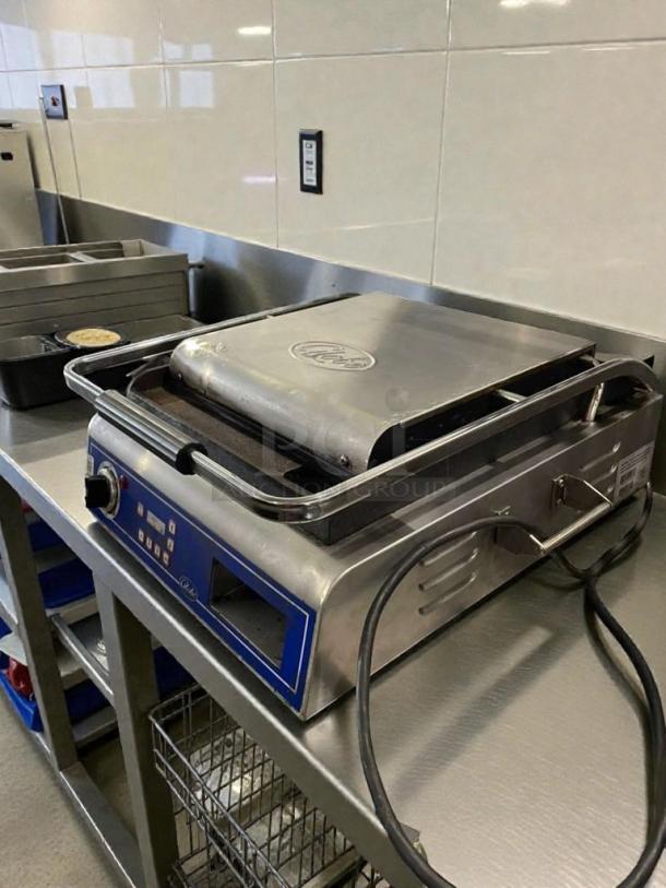 Globe GSG14D Commercial Panini Grill in outstanding condition; 120V, fully tested, stainless steel finish, manufactured by Globe Food Equipment Co.