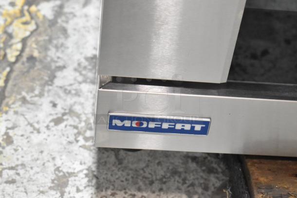 Brand new 2024 Moffat Turbofan E27M3 electric convection oven, scratched, dented; 208V, 1 phase, logo visible on stainless steel.