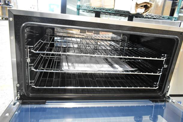 Brand new 2024 Moffat Turbofan E27M3 electric convection oven, countertop model, full size, 208V, 1 phase, open door view.