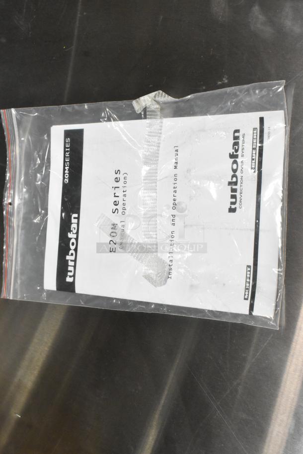 Brand new Moffat Turbofan E27M3 convection oven manual in sealed plastic bag; manual for 2024 model, 208V, 1 phase.