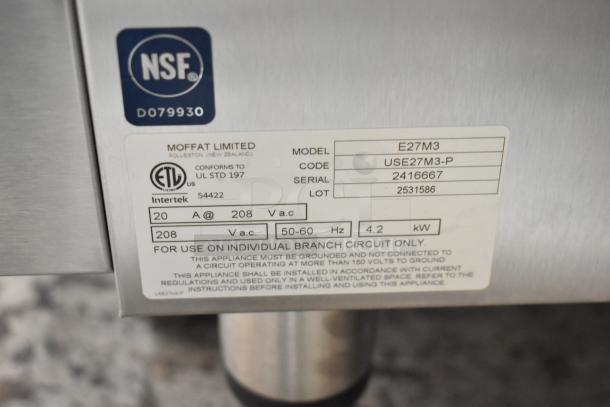 NSF and ETL labels on Moffat Turbofan E27M3 oven with model, serial, and voltage details visible on sticker.