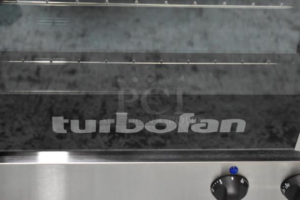 Brand new 2024 Moffat Turbofan E23M3 convection oven, 208V, 1 phase, stainless finish, minor scratches visible.