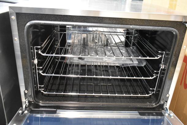Brand new 2024 Moffat Turbofan E23M3 convection oven. Half-size, electric, 208V, 1-phase. Interior racks visible.