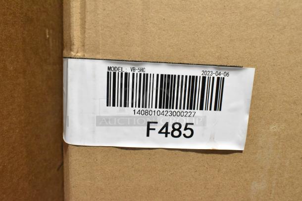 Barcode label on cardboard showing model VB-5HC and code F485, dated 2023-04-06, related to Excellence 215VB5LHC freezer.