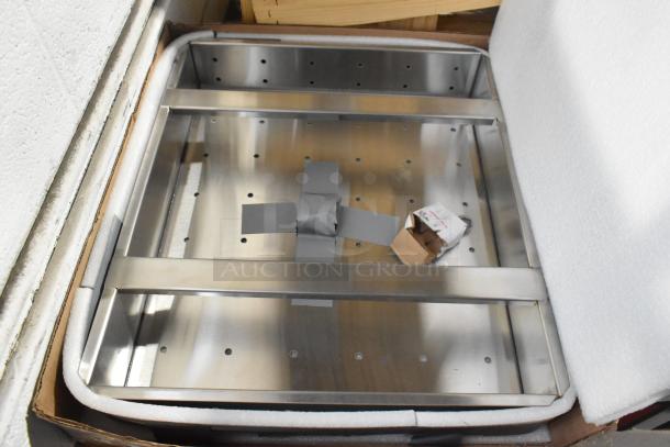 Brand new commercial drain bay strainer, stainless steel, scratch and dent condition, boxed with protective foam.