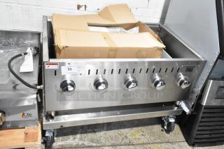 BRAND NEW Backyard Pro propane grill, scratch and dent model, five-burner, floor style, in stainless steel.
