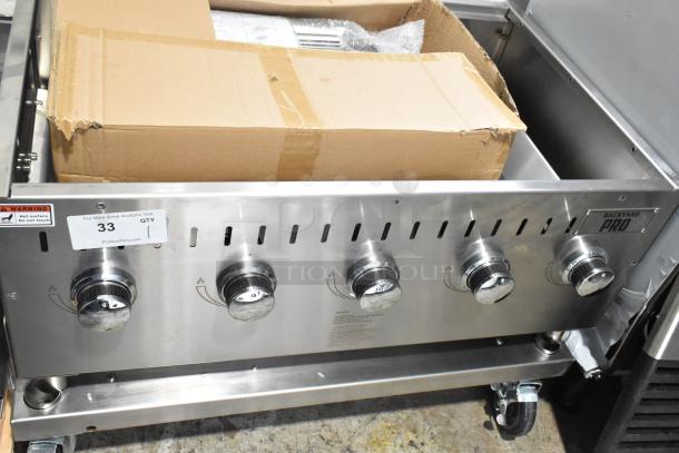 Brand new Backyard Pro propane grill, floor style, scratch and dent condition. Features five control knobs.