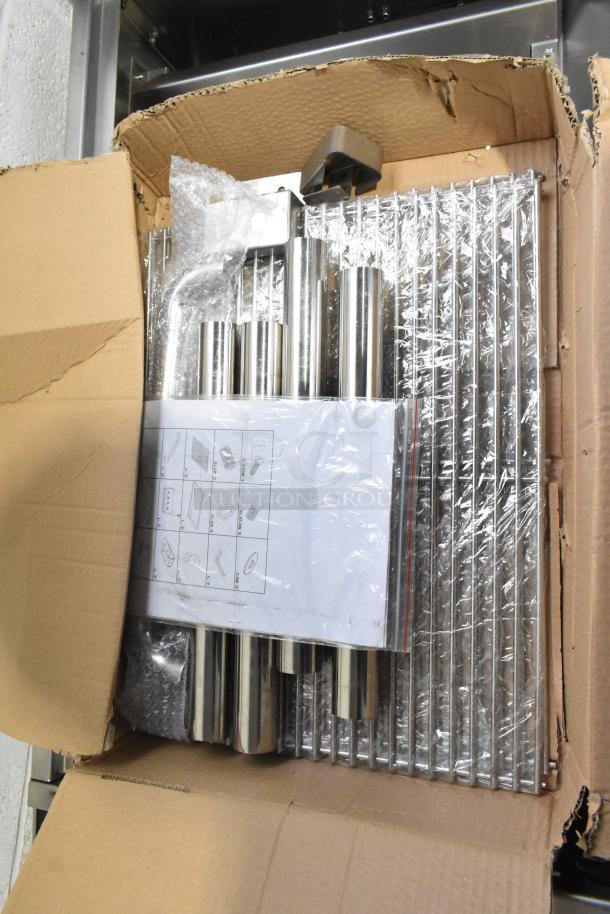 BRAND NEW Backyard Pro floor-style propane gas grill, scratch and dent. Stainless steel components in open box.