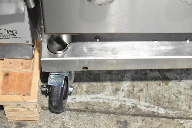 BRAND NEW SCRATCH AND DENT! Backyard Pro propane grill with caster wheels shown. Stainless steel body, slight scratches visible.