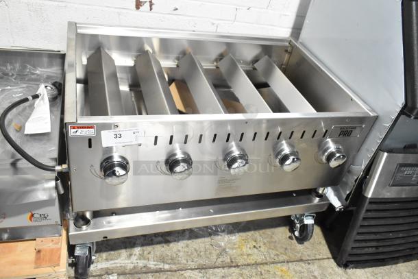 BRAND NEW Backyard Pro propane grill, scratch and dent, floor style, four burners, stainless steel, model label and warning tag visible.