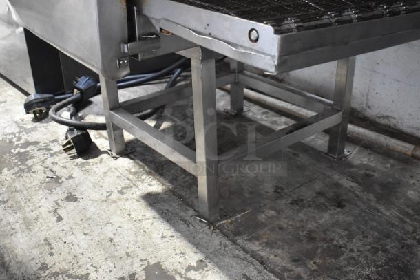 Turbochef HhC2020 commercial conveyor oven, electric, 208/240V, 3-phase; sturdy metal frame, power cables visible.