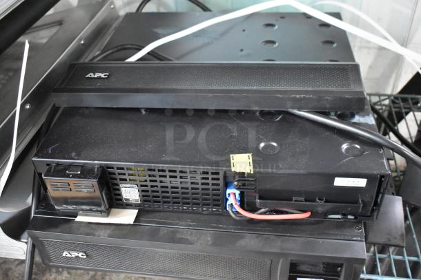 Brand new APC Uninterruptible Power Supply, scratch and dent condition, includes two boxes of metal pieces.