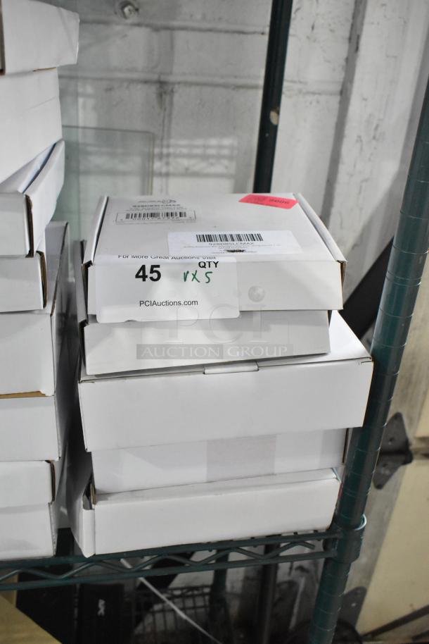 Stack of boxes containing 5 brand new AvaMix dicing grids/slicing discs, labeled "45 qty x5," atop a storage shelf.