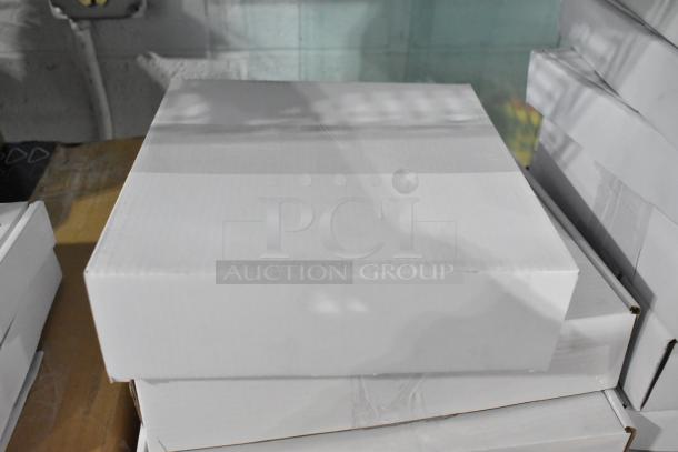 Five AvaMix dicing grids and slicing discs in new condition, packaged in plain white boxes on a warehouse shelf.