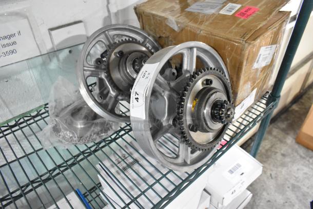 Two brand new metal units with visible gears, labeled "47 x 2" on shelving. Box in background; slight scratches present.