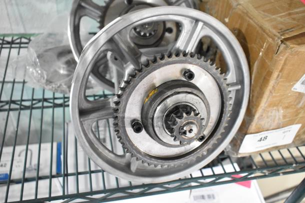 Metal gear units with visible scratches and dents on a shelf. Includes two units; brand new condition, some minor imperfections.