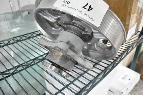 Two brand new metal units, scratch and dent condition, on a shelf. Labeled with "47" quantity tag.