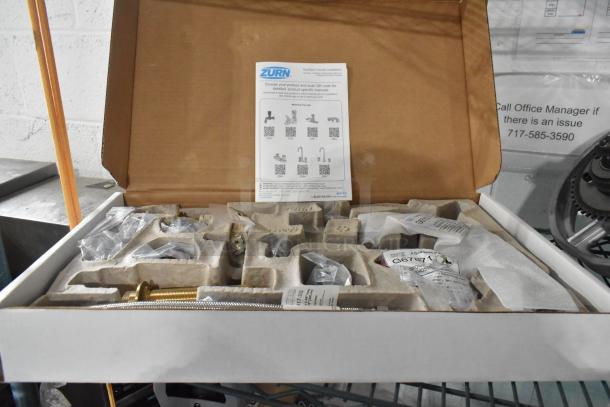 Brand new Zurn Elkay Z831B4-XL faucet in box, widespread base, 5 3/8" gooseneck spout, ceramic cartridge, wrist handles.