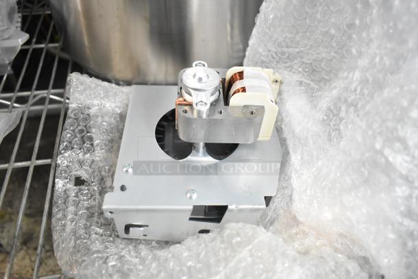 Brand new magnetron in silver with scratch and dent marks, wrapped in bubble wrap. Suitable for auctions.