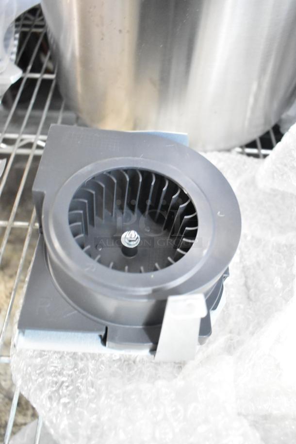 Brand new magnetron with minor scratches and dents on a metal base, secured in bubble wrap on a metal shelf.