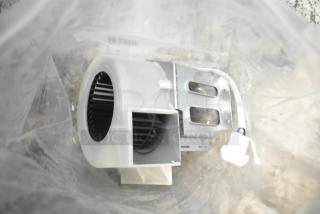 Brand new fan assembly in original packaging, minor scratches and dents, includes wiring and mounting bracket.