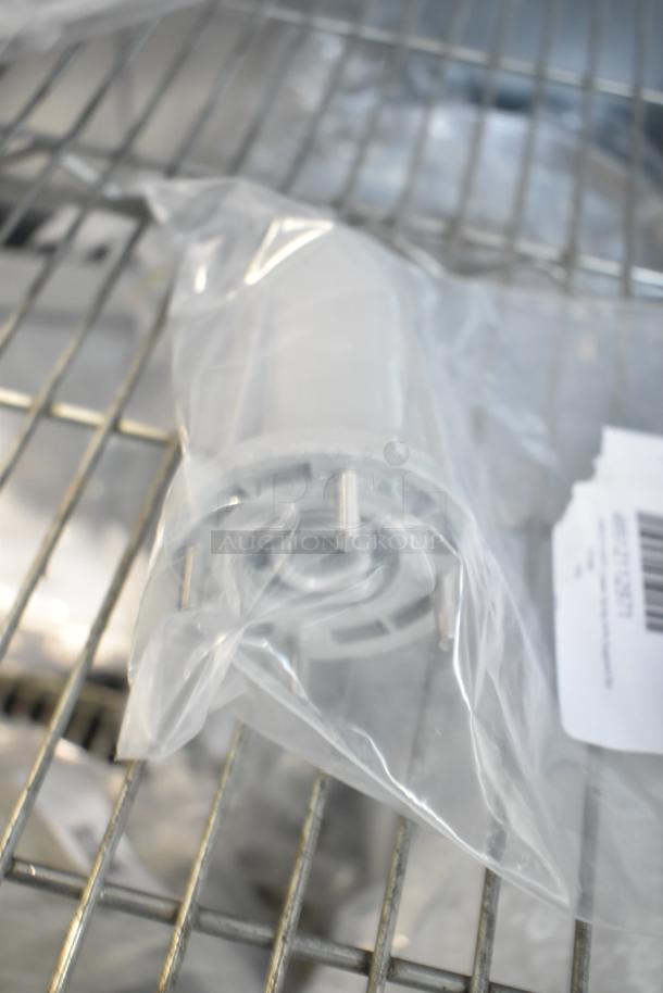 Brand new basket bushing in sealed bag; part of scratch and dent auction set with lower spray arm support included.