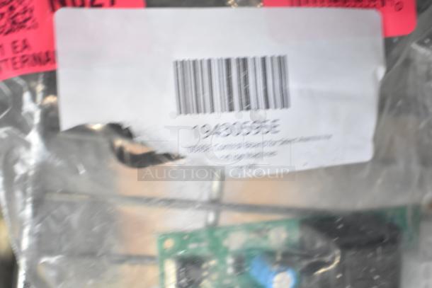 Four brand new scratch and dent control boards in packaging. Label shows part number 19430595E. 