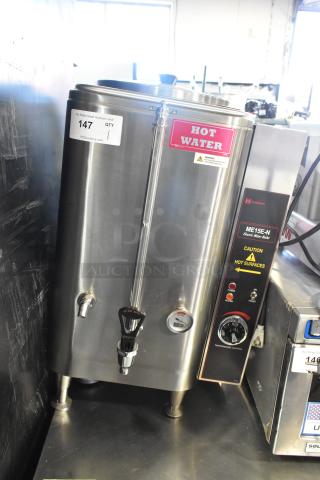 Grindmaster ME15EN commercial countertop water heater, stainless steel, 208/240V, 1 phase. "Hot Water" label, temperature control dial.