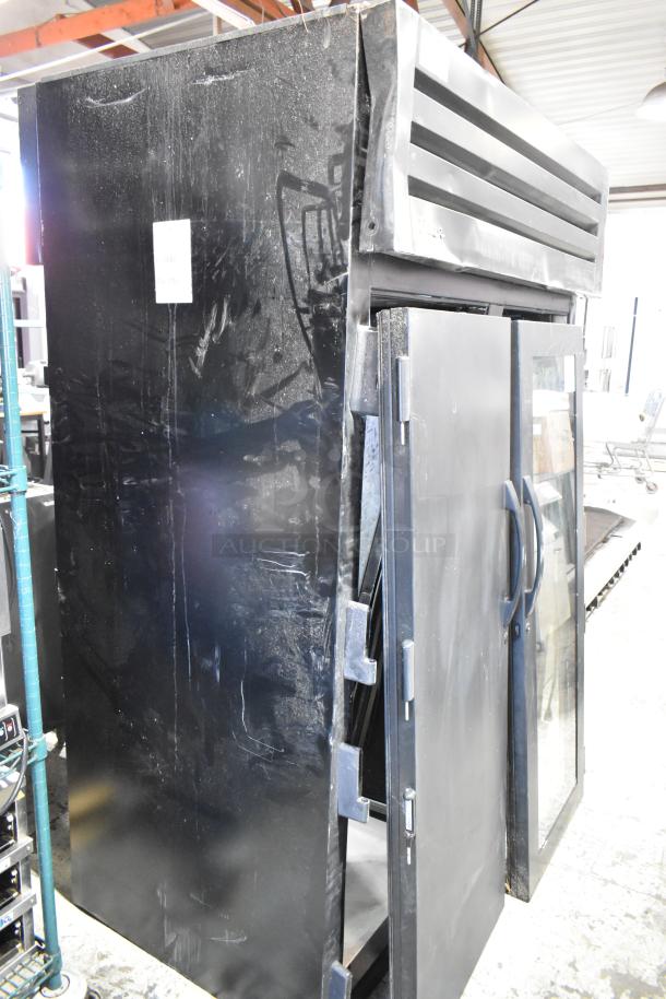 2024 True STG2RPTVLD-2G-2S-HC 2 Door Cooler Merchandiser; damage visible on exterior, 115V, 1 phase.