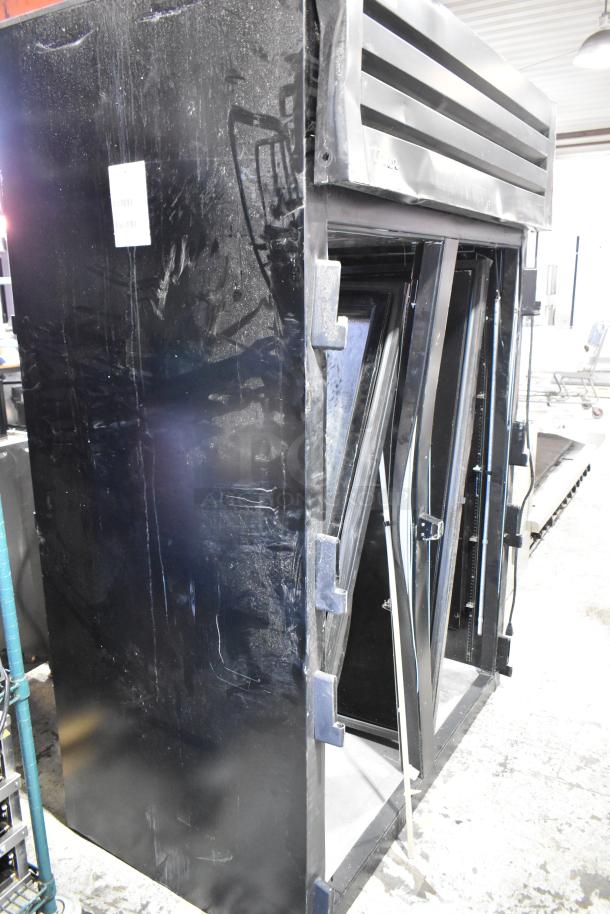 2024 True STG2RPTVLD-2G-2S-HC 2-door cooler with visible exterior damage, 115 volts, 1 phase.