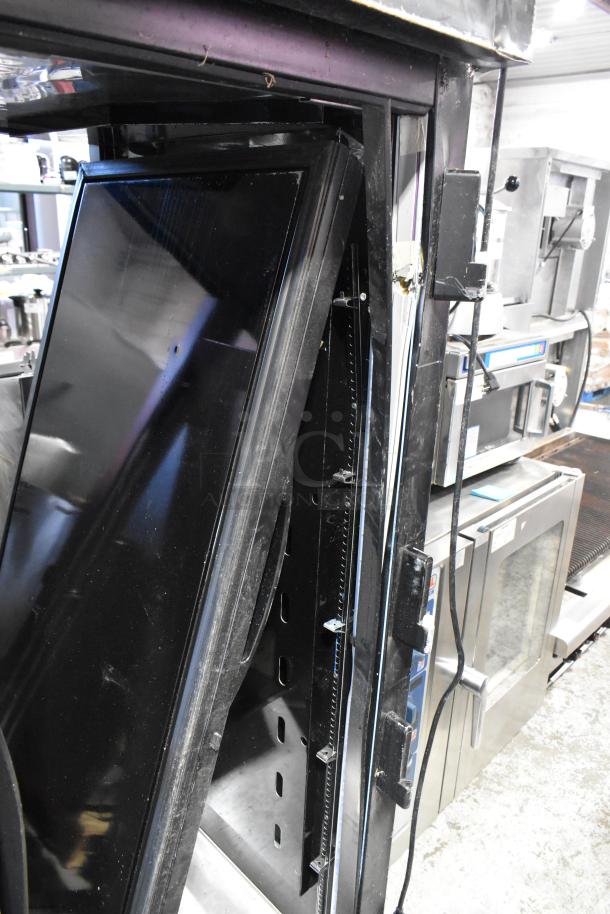 2024 True STG2RPTVLD-2G-2S-HC 2-door cooler with visible door damage, commercial use, 115V, 1 phase.