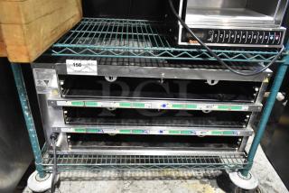2023 Prince Castle EHB34A-2 countertop holding bin, 208-240V, 1 Phase, stainless steel, three shelves, good condition.