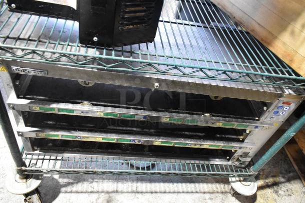 2023 Prince Castle EHB34A-2 holding bin, 208-240V, 1 Phase. Features three slots, control panel, visible labels, sturdy condition.