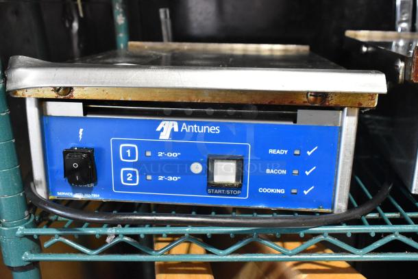 AJ Antunes ES-1200 countertop egg steamer in used condition. Features 208-240V power, control panel with settings, and timer.