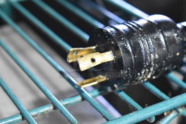 AJ Antunes ES-1200 commercial egg steamer plug, close-up. Compatible with 208-240V, 1 Phase. Visible wear.