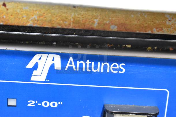 AJ Antunes ES-1200 Commercial Egg Steamer, blue panel with logo, voltage label, some surface rust visible.