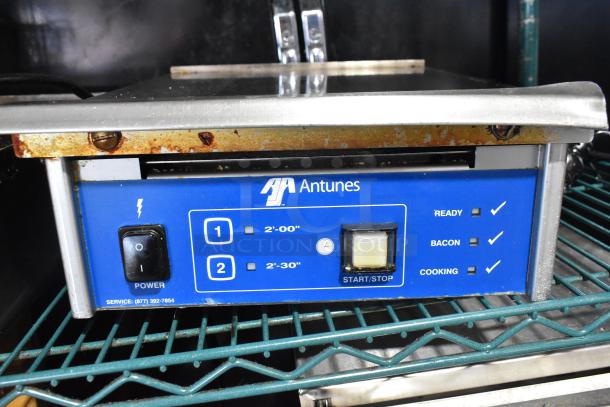 AJ Antunes ES-1200 Commercial Countertop Egg Steamer, features power switch, timer, and cooking indicators, visible wear.