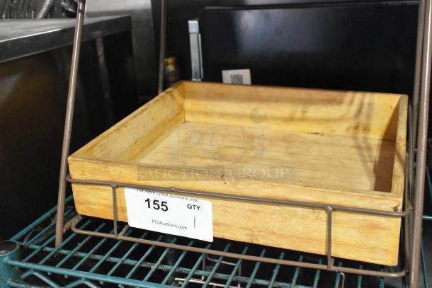 Countertop 2 Tier Merchandiser with wood trays and metal frame. Label reads "155 QTY" from PCI Auctions. Good condition.