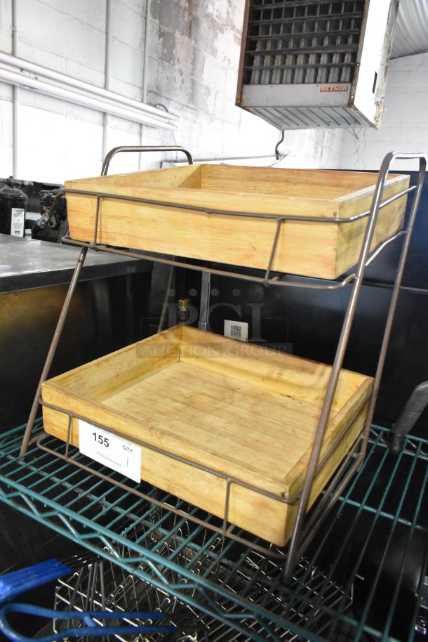 Countertop 2 tier merchandiser with wooden trays, metal frame, in good condition; auction ID tag 155 visible.