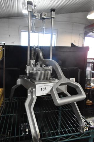 Industrial countertop vegetable cutter with dual springs and sharp blades, in good condition. Auction tag 156 visible.