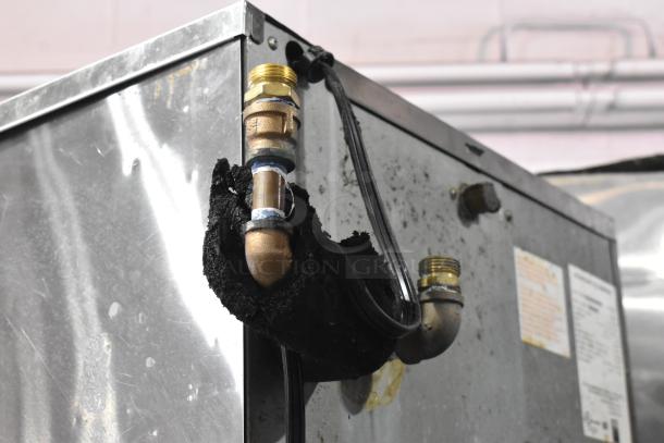 Hoshizaki KM-515MWH Commercial Ice Head on Bin, visible piping and connections, 115-120V, used condition.