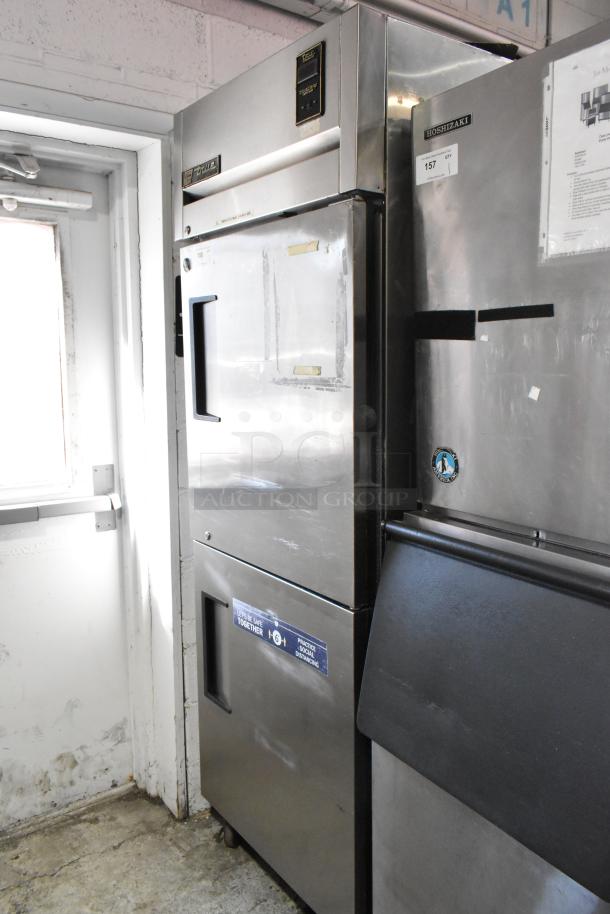 True TA1R-2HS commercial cooler, 2 half doors, on casters, 115V, 1-phase. Stainless exterior, visible wear.